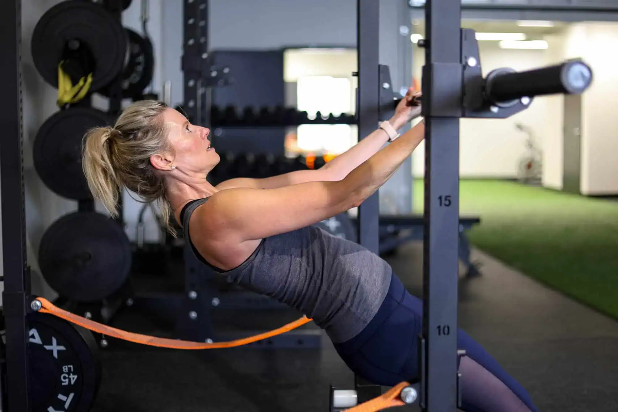 Athlete performing a return-to-sport strength exercise during rehabilitation training