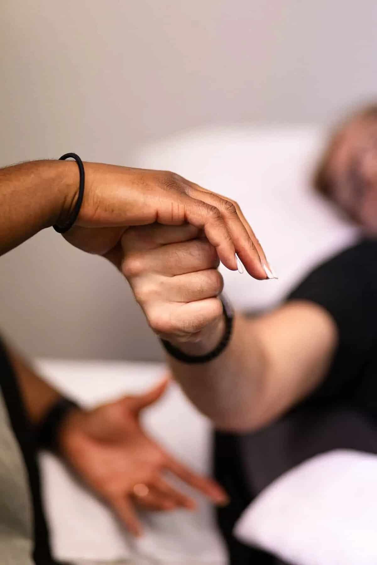 Close-up of hand and wrist examination during consultation
