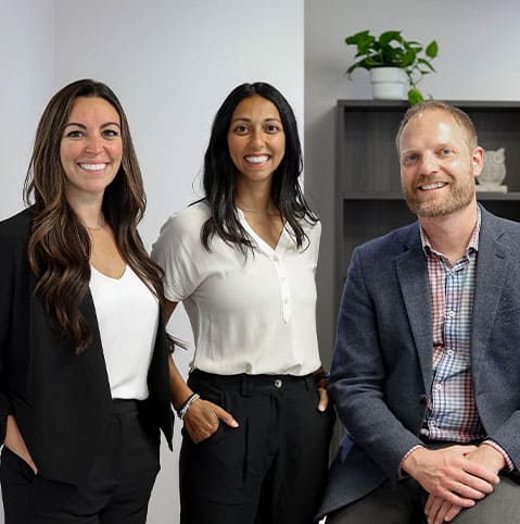Acumen Health clinical staff standing together in clinic office