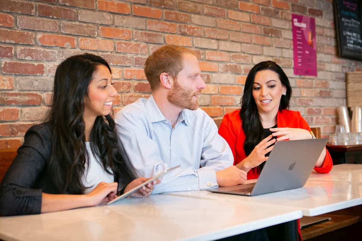 Acumen Health team members collaborating during a team meeting